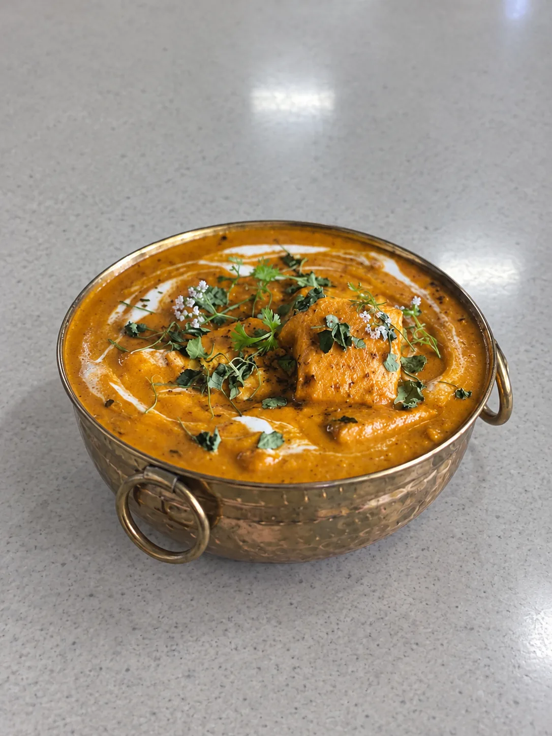 AI-generated simulated input photo of the same curry on a plain tabletop